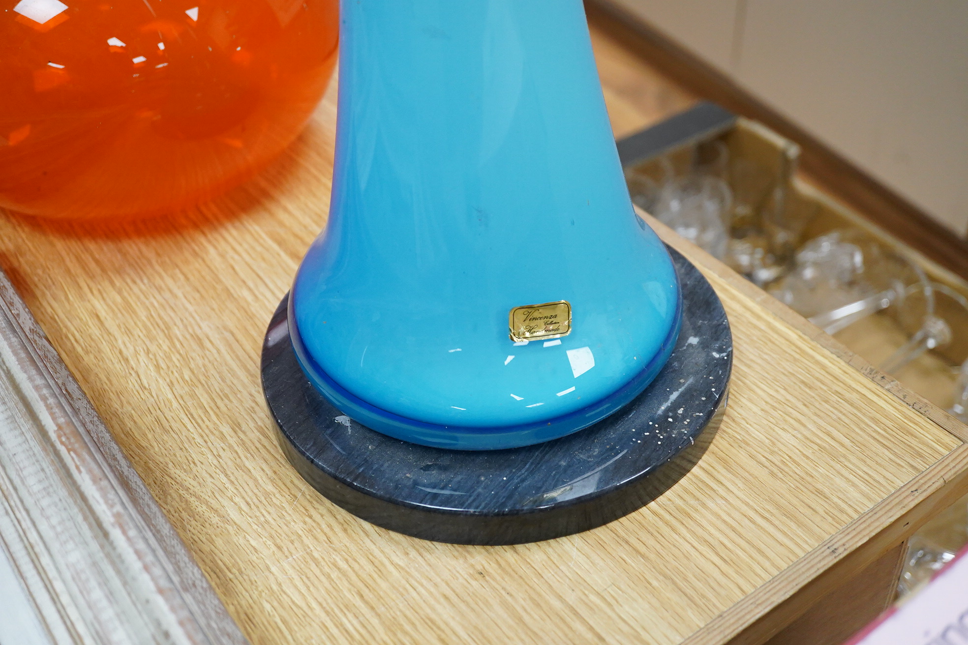 A Vincenza blue glass standard lamp base and a Italian Blenko oversized bottle and stopper, largest 143cm